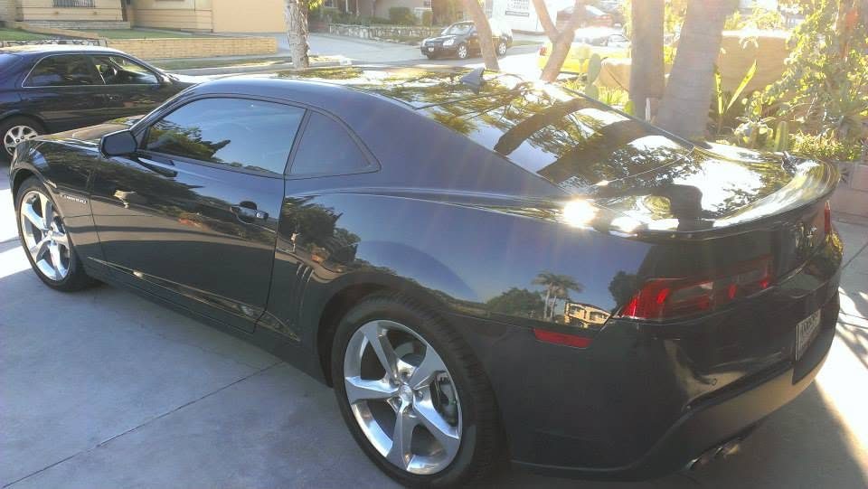 Black sports coupe with professionally tinted windows, tinted by TNT Window Tinting